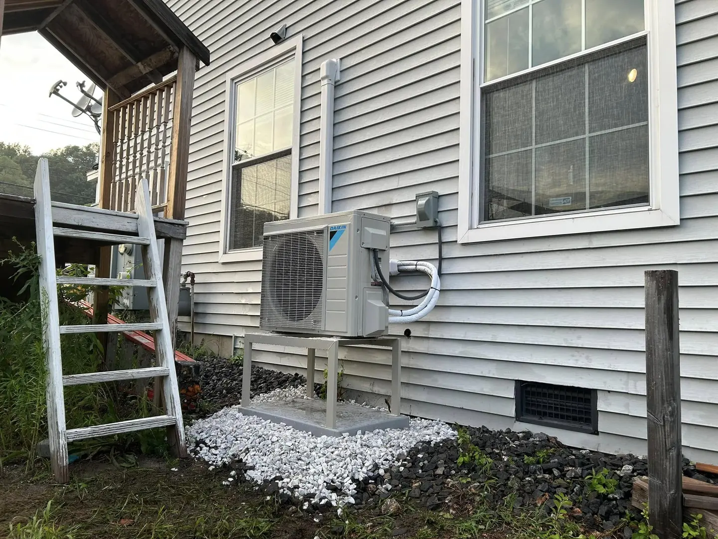 Ductless heat-pump condenser outside a home