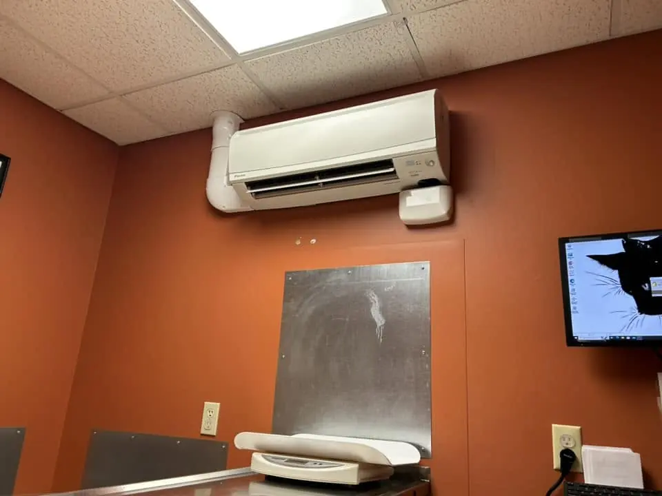 Wall-mounted ductless mini-split in a room