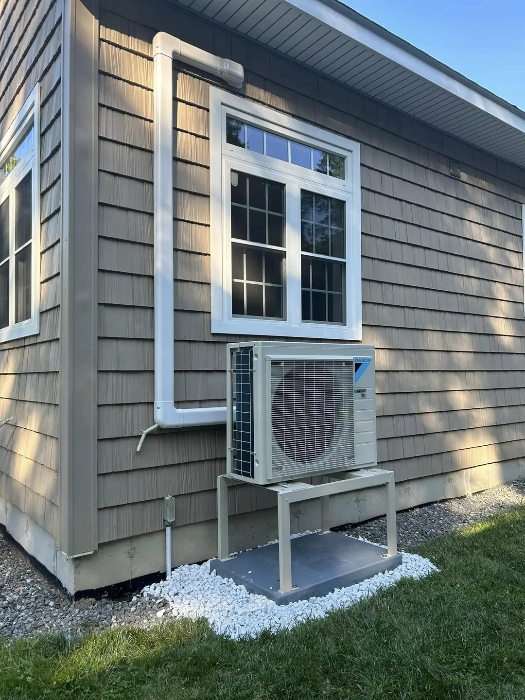 Outdoor ductless condenser on a residential wall