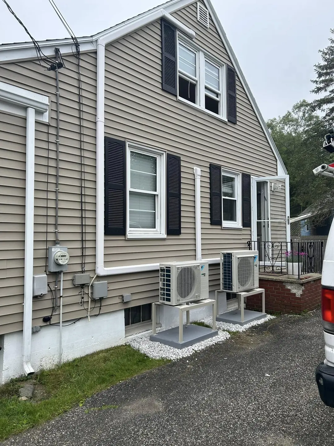 Exterior ductless line set running along house siding